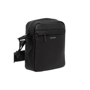 Black Calvin Klein crossbody bag with sleek design and adjustable strap