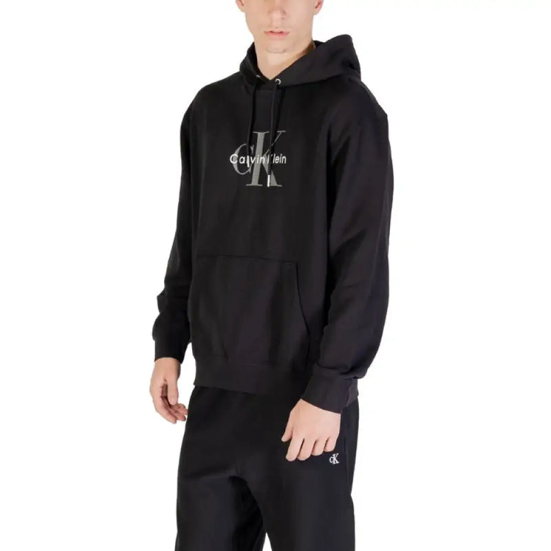 Black Calvin Klein hoodie and sweatpants set displayed in the Calvin Klein Black Hoodie and Sweatpants Set product image
