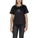 Black Calvin Klein t-shirt featuring a metallic CK logo displayed with a pink cotton top