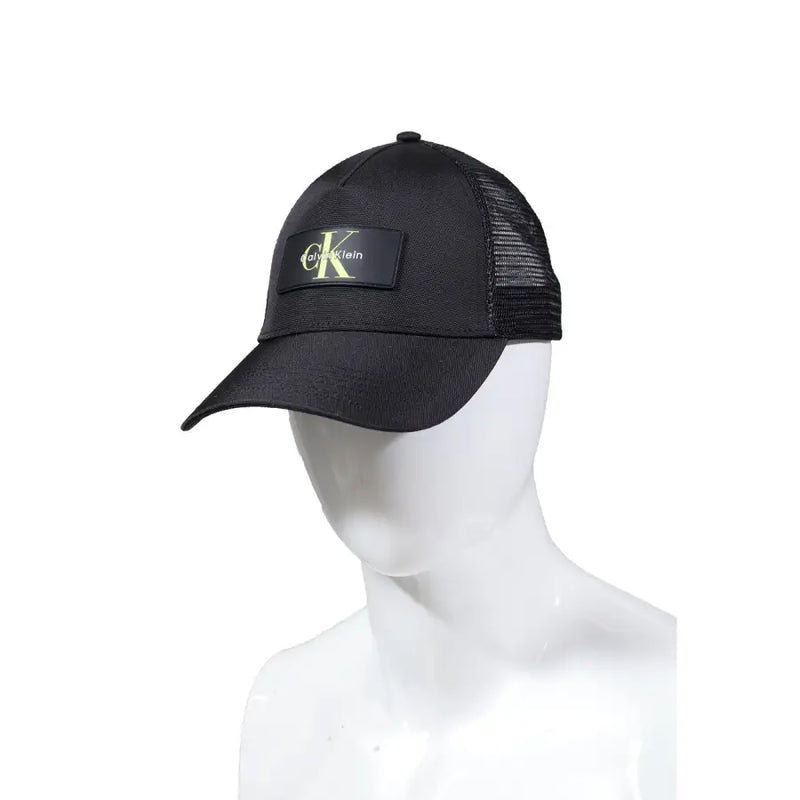 Black Calvin Klein mesh trucker cap featuring adjustable snapback closure