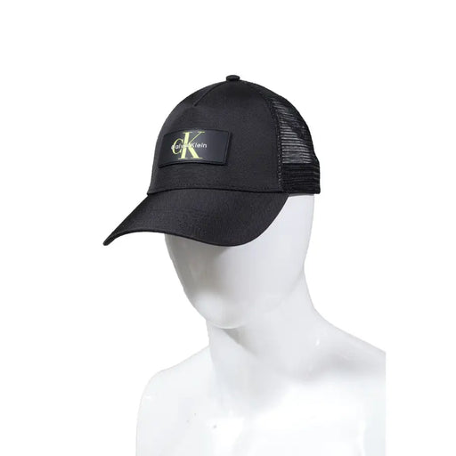 Black Calvin Klein mesh trucker cap featuring adjustable snapback closure