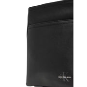 Black Calvin Klein jeans bag displayed as Calvin Klein Black Messenger Bag in product image