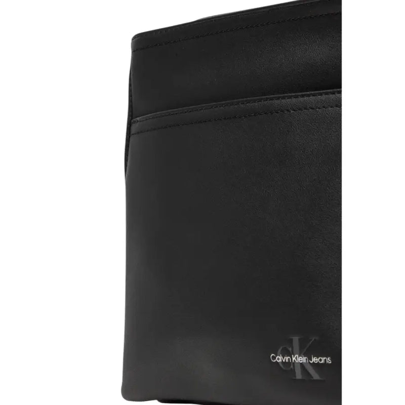 Black Calvin Klein jeans bag displayed as Calvin Klein Black Messenger Bag in product image