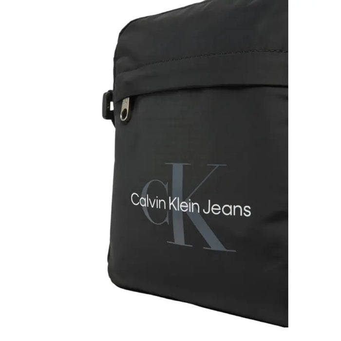 Black Calvin Klein Messenger Bag featuring a sleek design and durable construction