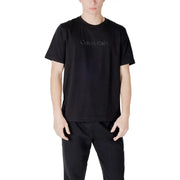 Black Calvin Klein T-shirt and pants set displayed with a white Calvin Klein T-shirt product
