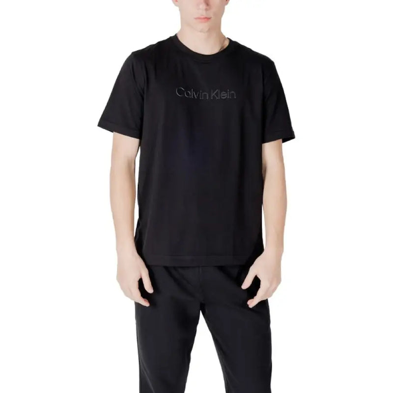 Black Calvin Klein T-shirt and pants set displayed with a white Calvin Klein T-shirt product