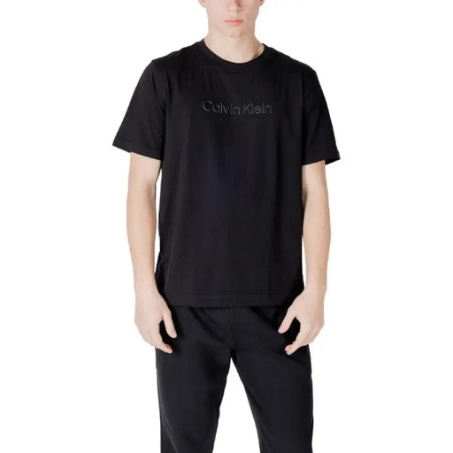 Black Calvin Klein T-shirt and pants set displayed with a white Calvin Klein T-shirt product
