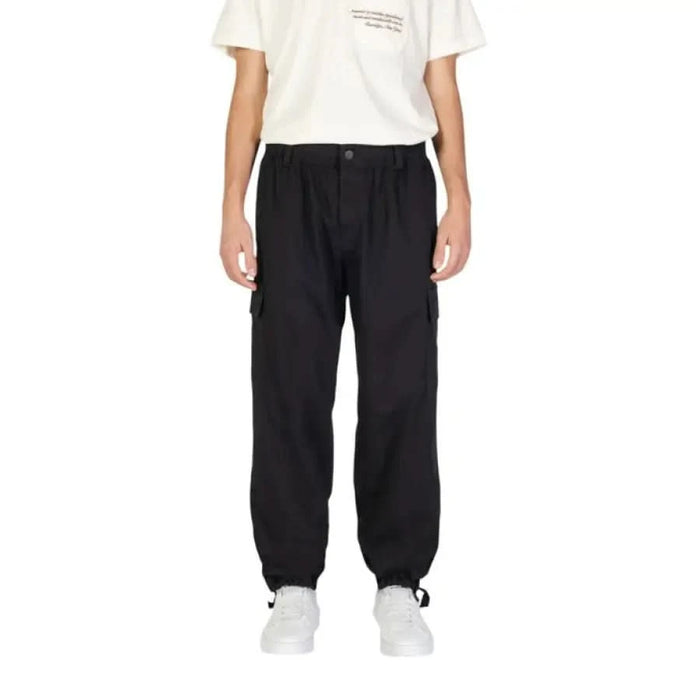 Black cargo pants with elastic cuffs by Calvin Klein for men, stylish and functional