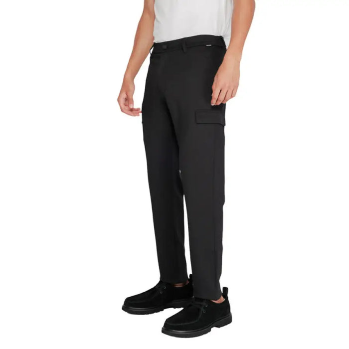 Black Cargo Pants displayed in the product listing with multiple pockets and a modern fit