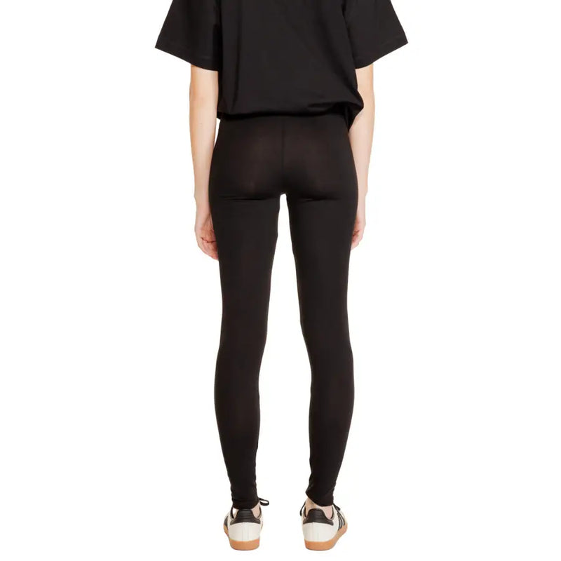 Black cotton leggings for women by Jacqueline De Yong with high waist smooth form-fitting material and subtle seam detailing