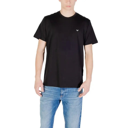 Black crewneck T-shirt displayed with Blue Jeans in a fashion product image