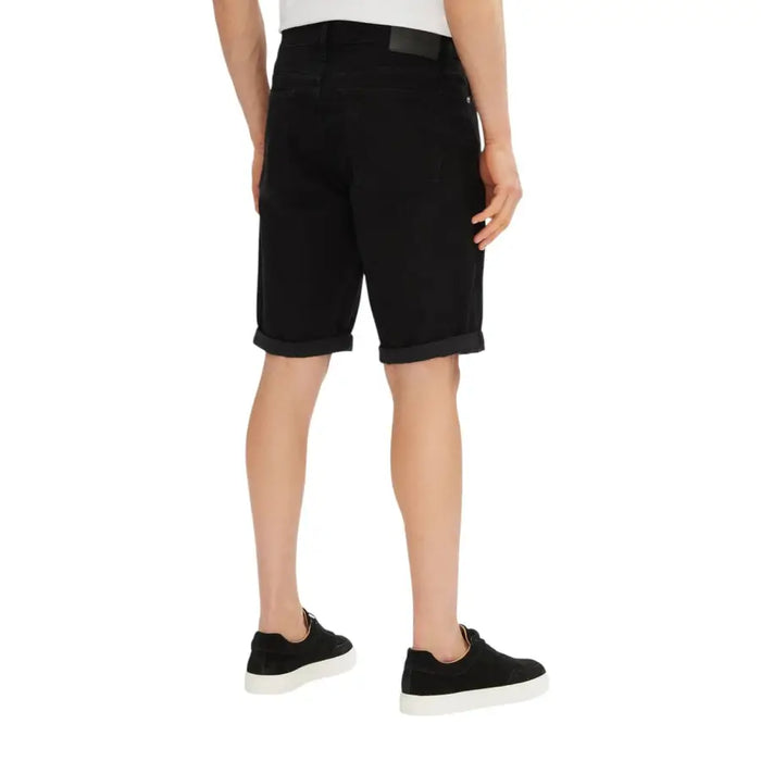 Black denim shorts displayed with a Men’s White T-Shirt in a fashion product image