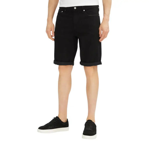 Black denim shorts with cuffed hems displayed with a Men’s White T-Shirt