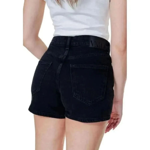 Vero Moda black denim shorts paired with a white top, perfect for casual chic looks