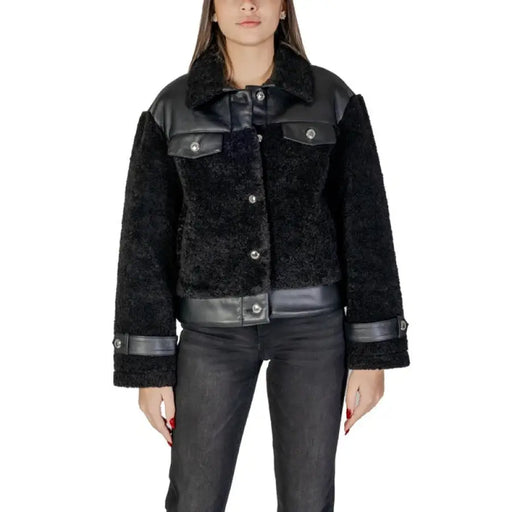 Black faux fur jacket with leather accents showcasing a stylish and luxurious outerwear piece