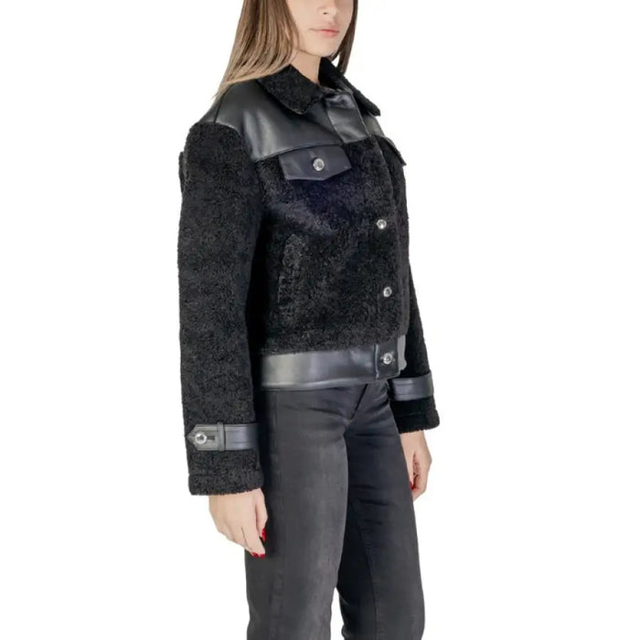 Black faux fur jacket with leather accents showcasing luxurious winter fashion