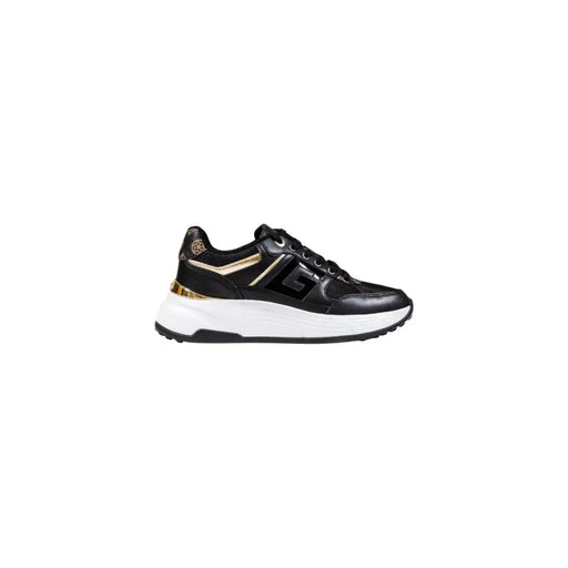 Black and gold women’s athletic sneaker with thick white sole from Guess Women Platform Sneakers collection
