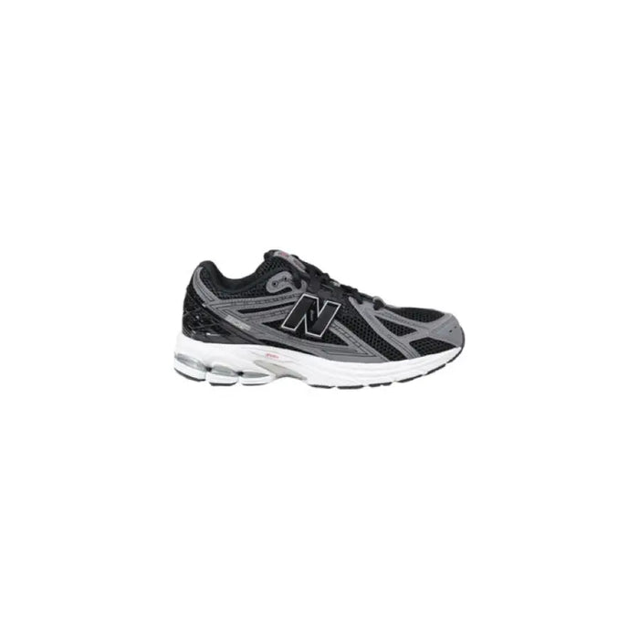Black and gray New Balance sneaker displayed in the New Balance White Sneaker product image