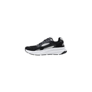 Black, white, and gray running shoe displayed for athletic footwear product