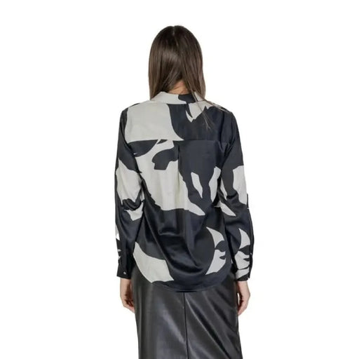 Back view of Women’s Black Long V-Neck Shirt in black and grey camouflage print