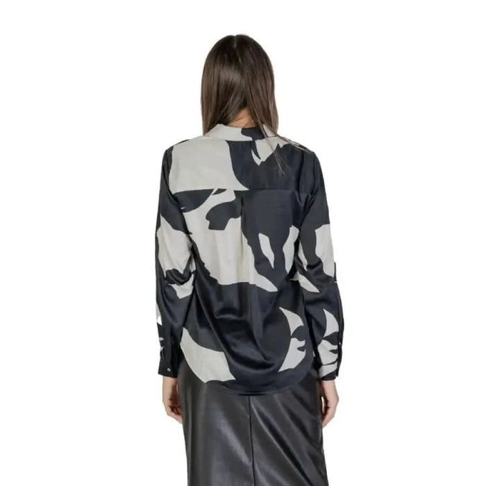 Back view of Women’s Black Long V-Neck Shirt in black and grey camouflage print