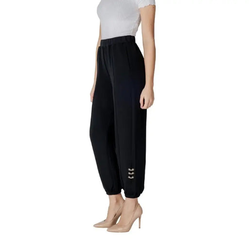 Black high-waisted cuffed jogger pants with decorative side accents for stylish comfort