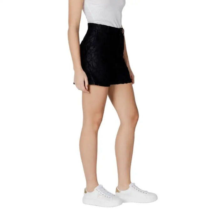 Black high-waisted mini skirt for women displayed in a product image
