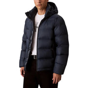 Doudoune noire à capuche, bleu marine foncé, matelassée et dotée d'une capuche isolée pour une protection optimale contre le froid.