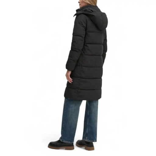 Black hooded puffer coat worn by model showcasing the Black Hooded Puffer Jacket