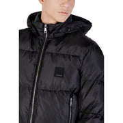 Black hooded puffer jacket with quilted design and silver zipper accents for cold weather use