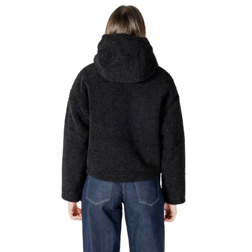 Black hooded Sherpa jacket featuring a cozy fleece lining and stylish design