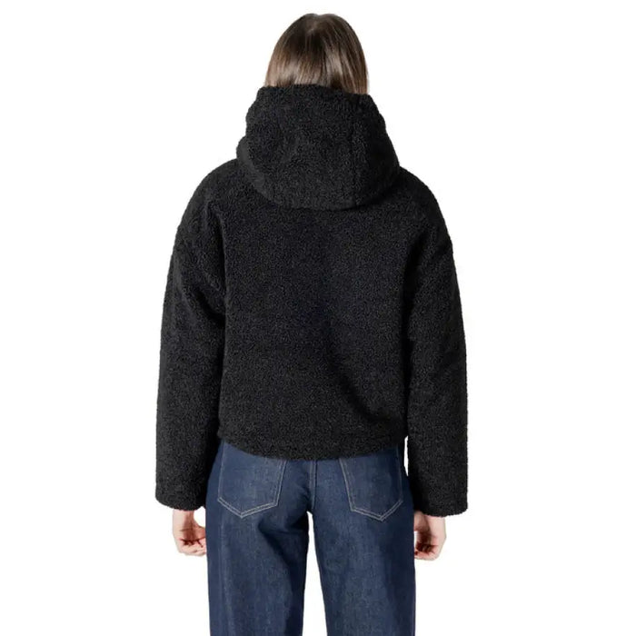 Black hooded Sherpa jacket featuring a cozy fleece lining and stylish design