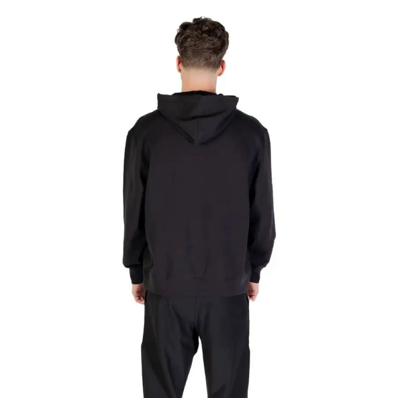 Calvin Klein black hoodie and matching sweatpants set displayed on a model