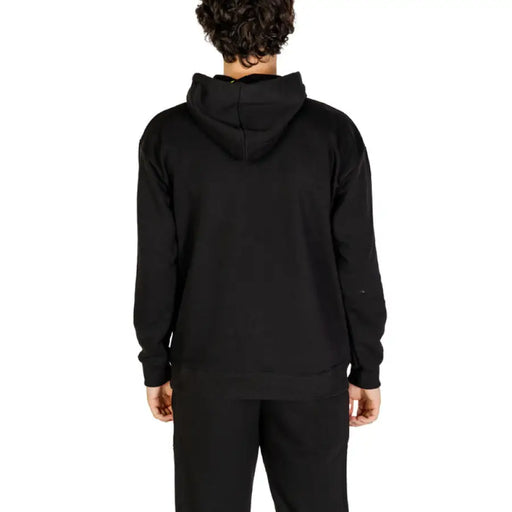 Black hooded sweatshirt and sweatpants set with colorful icons for a stylish casual look