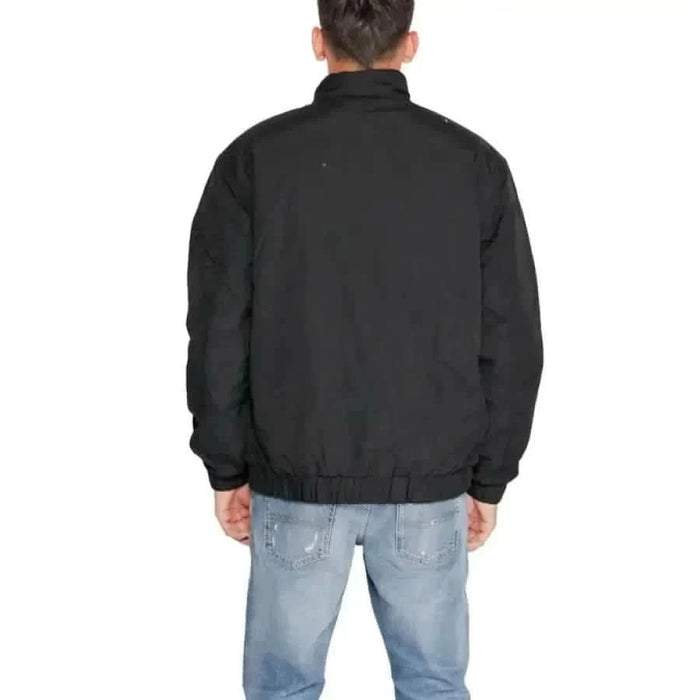 Black jacket viewed from the back, featuring Tommy Hilfiger Men Jacket design