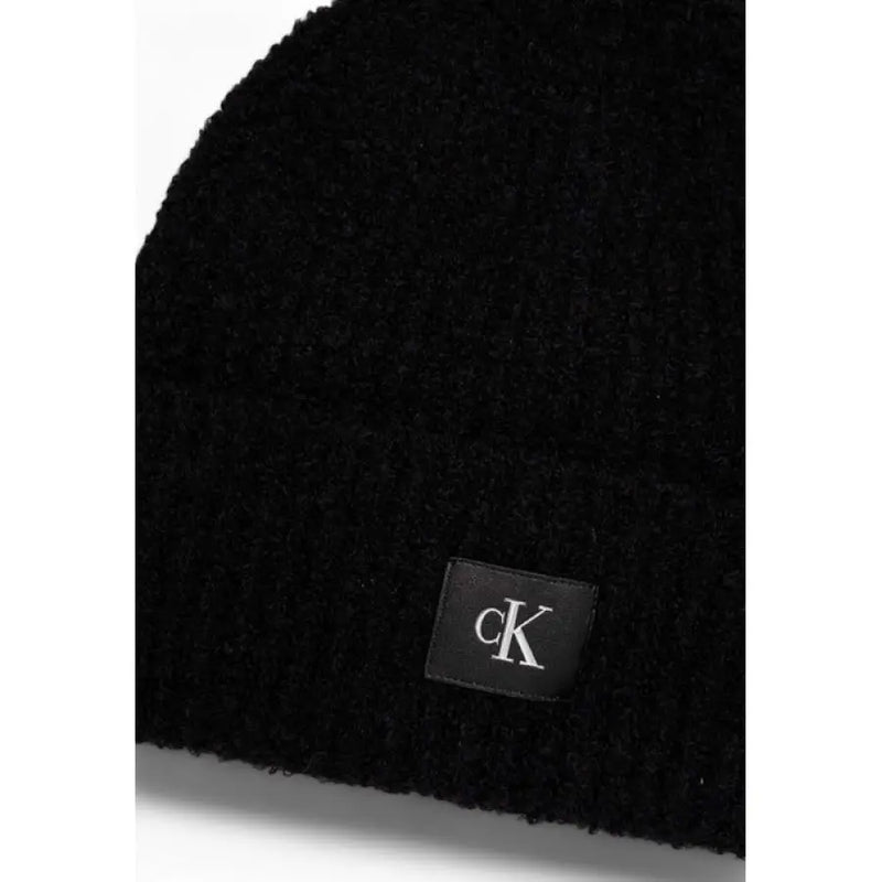 Black knit beanie with logo patch for stylish winter wear