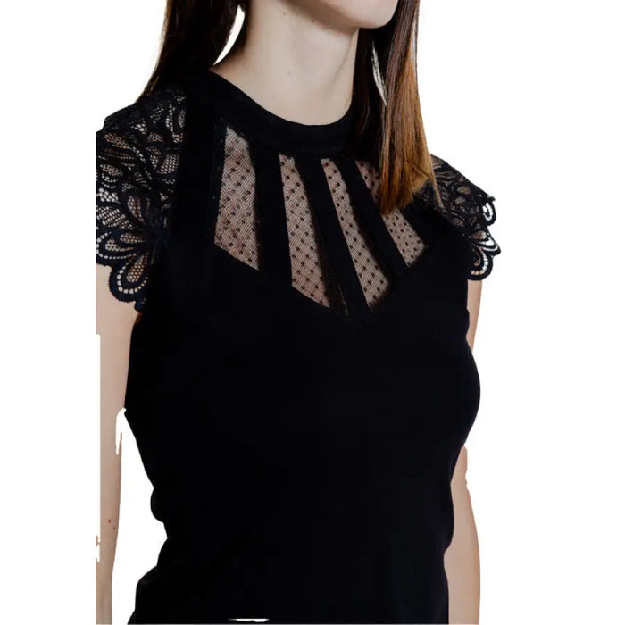 Black sleeveless top with lace trim and mesh detailing for elegant fashion style
