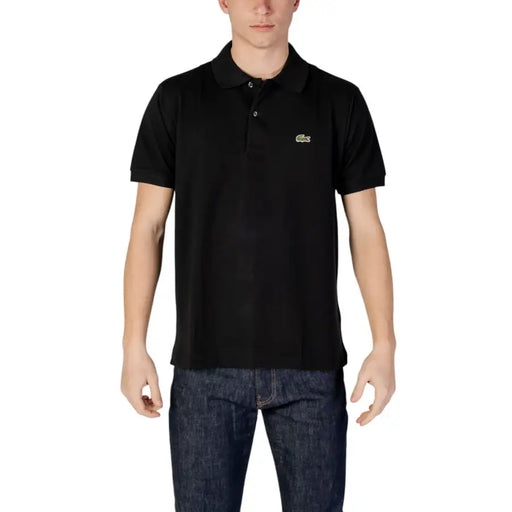 Polo Lacoste noir à manches courtes orné d'un logo crocodile vert sur la poitrine