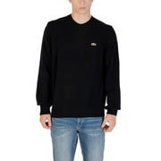 Black Lacoste Long Sleeve Sweater displayed on a mannequin in a retail store