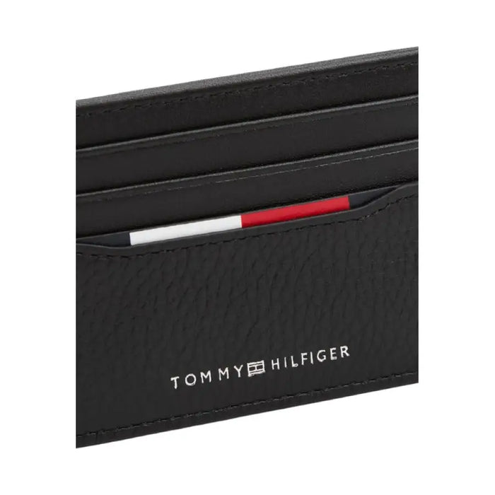 Black leather card holder from Tommy Hilfiger displayed on a white background