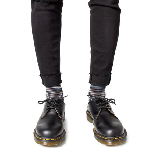 Black leather Dr. Martens Mens Lace Up Shoes showcasing a stylish and durable design