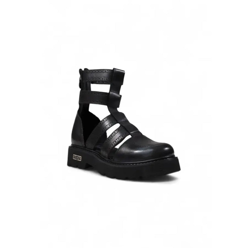 Black leather gladiator style platform boot featuring crisscross straps and a chunky sole for bold fashion