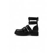 Black leather gladiator style ankle boot with crisscross straps and a chunky platform sole