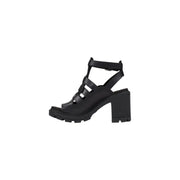 Black leather open toe heeled sandal with strappy design, chunky block heel, and textured sole
