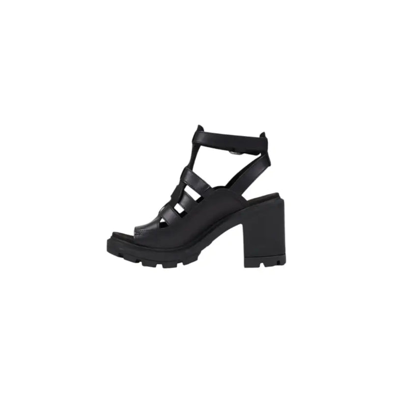 Black leather open toe heeled sandal with strappy design, chunky block heel, and textured sole