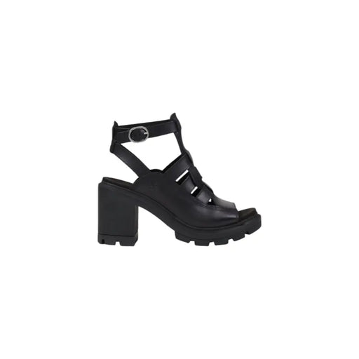 Black leather open toe heeled sandal with chunky heel and ankle strap, shown from the back side