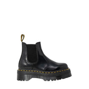 Black leather platform chelsea boot showing the back side with smooth polished finish and sturdy sole