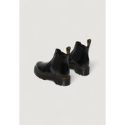 Black leather platform Chelsea boot in patent leather with yellow stitching and chunky rubber sole