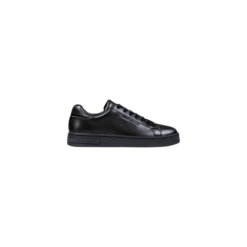 Black leather low-top sneaker with white laces and sole, calvin klein brand.