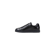 Black leather sneaker with white sole and laces, classic design.